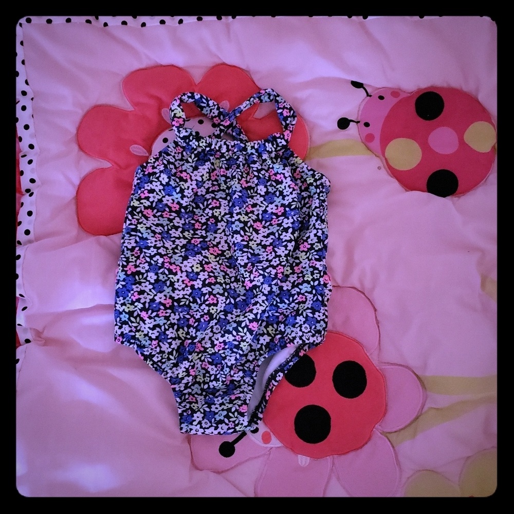 Babygirl one piece bathing suit.